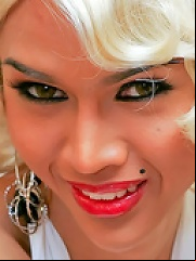 Lovely blonde ladyboy wrapping her stick as a gift