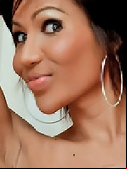 Stunning tanned ladyboy jerks off her dick
